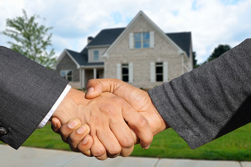 Why use an estate agent to sell your property - shaking hands